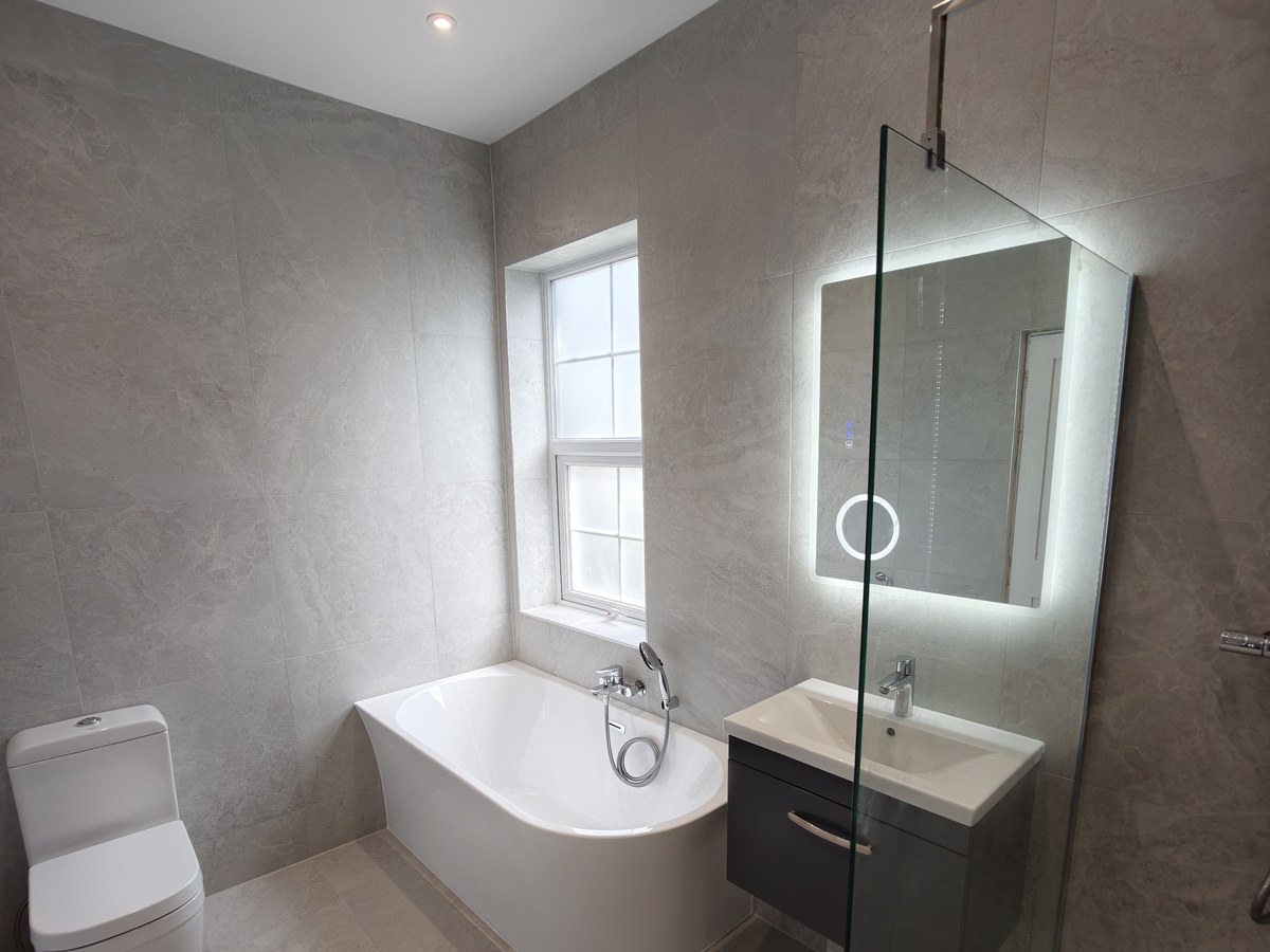 Walk-in shower and freestanding bath fitted in Farnham
