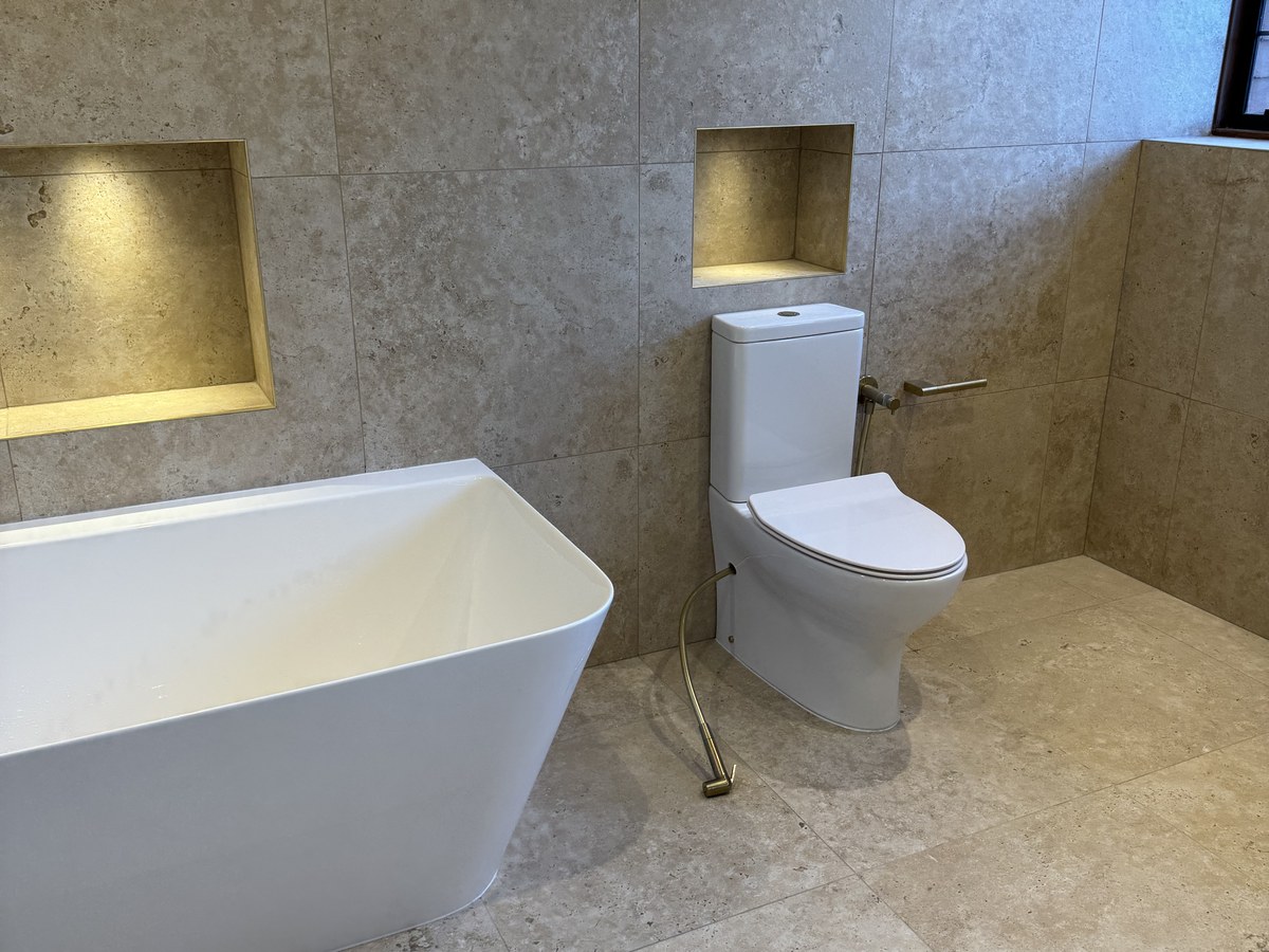 Fully tiled family bathroom in Godalming by Gary James