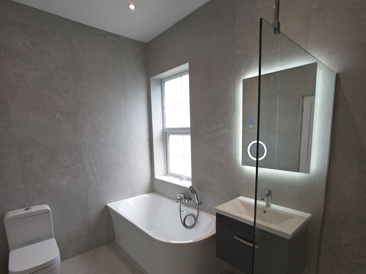 Walk-in shower and freestanding bath fitted in Woking