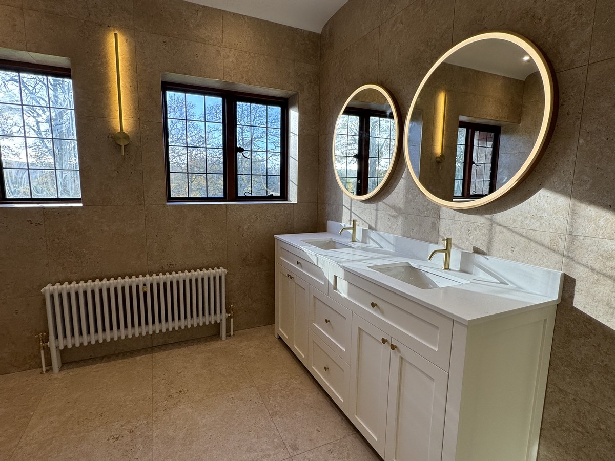 Fully tiled family bathroom in Woking by Gary James